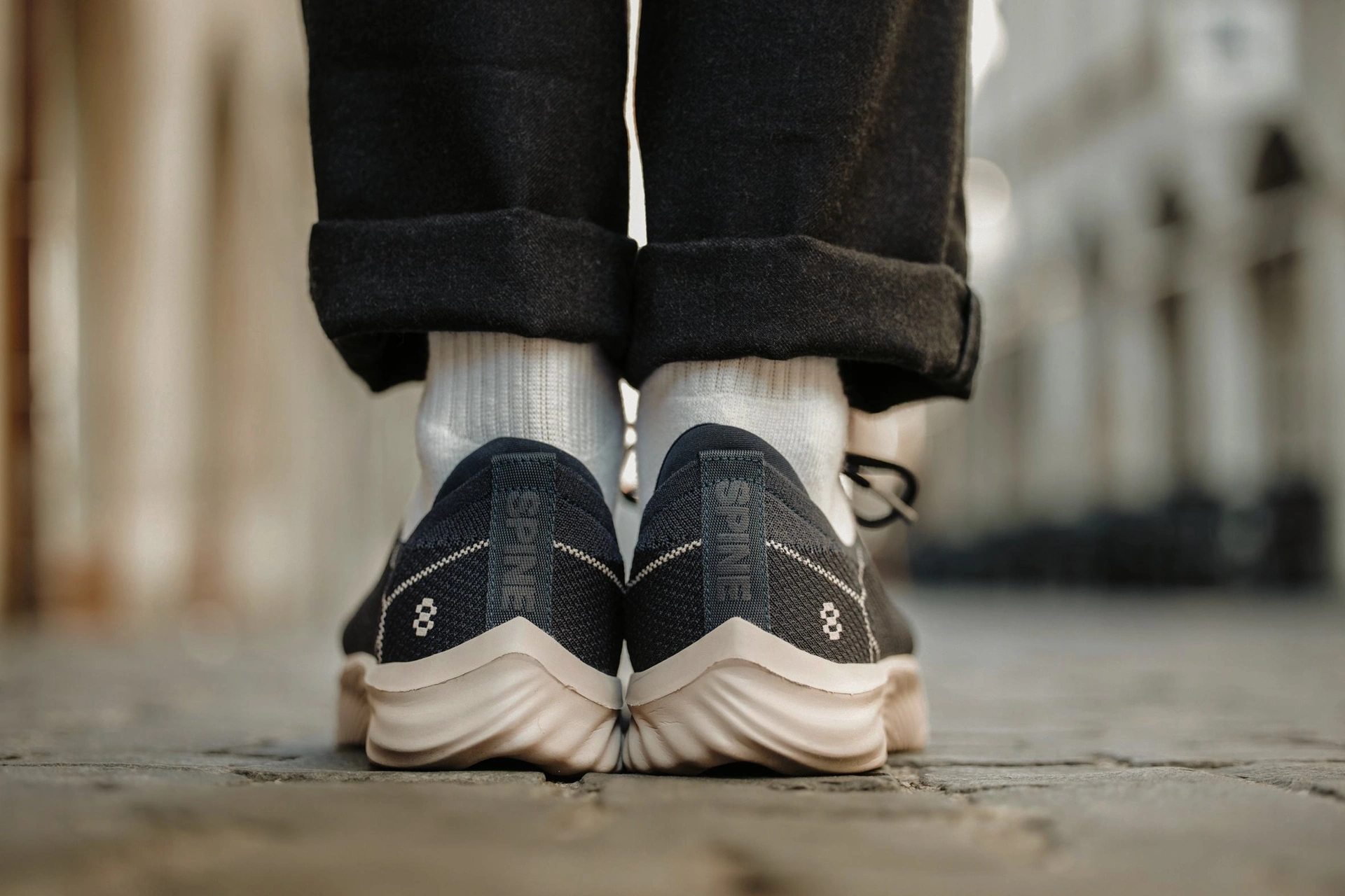 Spine footwear photographed from behind, showing the shoes and their distinctive soles